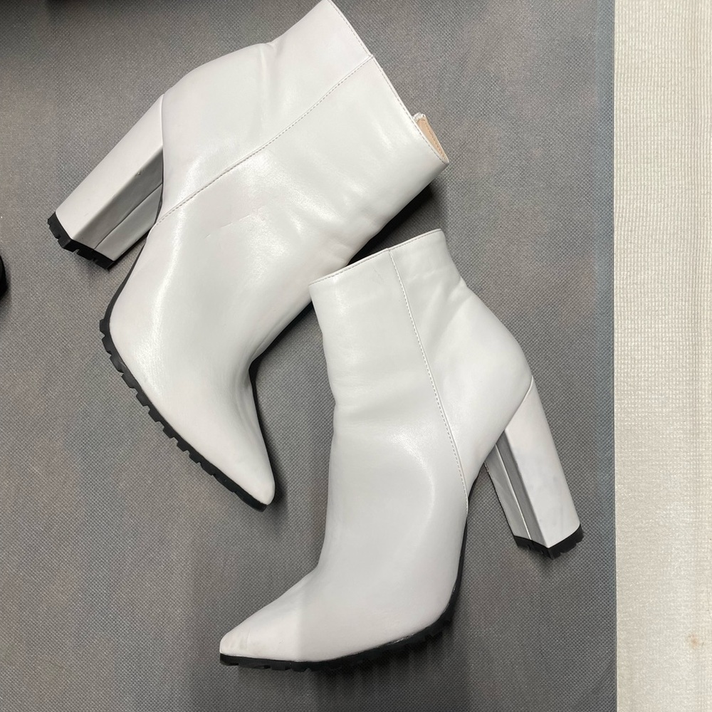 Size 10 worn once white zip up booties. OBO